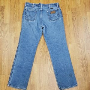Vintage Wrangler men's distressed jeans with patch